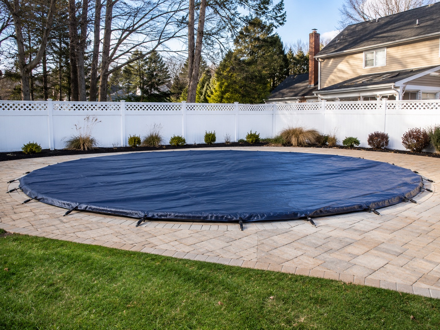 Round pool covered and secured for winter